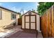 Outdoor storage shed with a front-facing door, offering additional space for tools or equipment at 1060 S Eaton St, Lakewood, CO 80226
