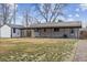 Spacious backyard with a covered patio and detached shed at 5060 S Fox St, Englewood, CO 80110