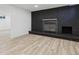 Cozy basement with a modern fireplace and new floors at 5060 S Fox St, Englewood, CO 80110
