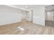 Finished basement featuring new floors, fresh paint, and recessed lighting at 5060 S Fox St, Englewood, CO 80110