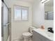 Bright bathroom with white countertops, shower, and gray vanity at 5060 S Fox St, Englewood, CO 80110