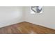 Bedroom featuring hardwood floors and natural light at 5060 S Fox St, Englewood, CO 80110