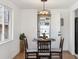 Bright dining room featuring a round table, stylish lighting, and cozy atmosphere at 5060 S Fox St, Englewood, CO 80110