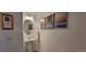 Powder room with pedestal sink, decorative mirror, and modern finishes at 9279 Merino Ct # B, Littleton, CO 80125
