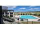 Inviting community pool with lounge chairs, picnic tables, and scenic views of rolling hills at 9279 Merino Ct # B, Littleton, CO 80125
