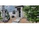 Charming townhome with a welcoming entrance, stone accents, and a well-maintained front yard at 9279 Merino Ct # B, Littleton, CO 80125