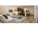 Inviting living room and kitchen featuring a comfortable sofa, modern appliances, and stylish decor at 9279 Merino Ct # B, Littleton, CO 80125