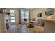 Charming living room featuring a cozy sectional sofa, fireplace, and stylish decor, perfect for relaxing and entertaining at 9279 Merino Ct # B, Littleton, CO 80125