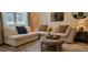 Comfortable living room featuring a plush sectional sofa and stylish ottoman, creating an inviting space at 9279 Merino Ct # B, Littleton, CO 80125