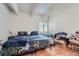 Bedroom with wood floors, light walls and a window at 384 S Ironton St # 201, Aurora, CO 80012