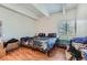 Bedroom with wood floors, light walls and a window at 384 S Ironton St # 201, Aurora, CO 80012