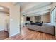 Spacious living room featuring wood floors and a stone fireplace at 384 S Ironton St # 201, Aurora, CO 80012
