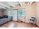Bright living room featuring wood floors, modern lighting, and large windows at 384 S Ironton St # 201, Aurora, CO 80012