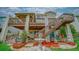 Charming backyard featuring a multi-tiered deck, fountain, and lush landscaping at 9832 N Crystal Lake Dr, Littleton, CO 80125