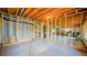 Unfinished basement showing exposed wood beams and framing, ready to be customized at 9832 N Crystal Lake Dr, Littleton, CO 80125