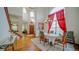 Elegant dining room with natural light, hardwood floors, and grand staircase at 9832 N Crystal Lake Dr, Littleton, CO 80125