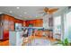 Updated kitchen featuring stainless steel appliances, granite countertops, and wood cabinetry at 9832 N Crystal Lake Dr, Littleton, CO 80125