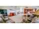 Spacious living room with a fireplace, wet bar, and open access to the kitchen at 9832 N Crystal Lake Dr, Littleton, CO 80125