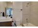 Full bathroom offering a modern sink, toilet, and a shower/bathtub combination at 5469 S Curtice St # L, Littleton, CO 80120