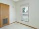 Cozy bedroom with a large window and a closet for storage at 8481 Uinta St, Commerce City, CO 80022