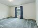 Carpeted bedroom featuring a ceiling fan and a window with privacy blinds and drapes at 8481 Uinta St, Commerce City, CO 80022