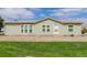 Single-story home with well-maintained lawn and neutral exterior at 8481 Uinta St, Commerce City, CO 80022