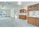 Bright, open-concept living and dining area featuring wood cabinetry and an open floorplan at 8481 Uinta St, Commerce City, CO 80022