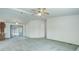 Spacious living room featuring carpet, a ceiling fan and sliding glass doors at 8481 Uinta St, Commerce City, CO 80022