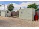 View of outdoor sheds in a gravel lot, some with windows and doors at 8481 Uinta St, Commerce City, CO 80022