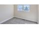 Neutral bedroom featuring carpeting and a window providing natural light at 2415 E 110Th Dr, Northglenn, CO 80233