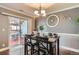 Dining room with modern lighting and patio access at 2415 E 110Th Dr, Northglenn, CO 80233