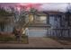Charming two-story townhome with attached two-car garage and mature landscaping at 2415 E 110Th Dr, Northglenn, CO 80233