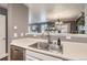 Bright kitchen featuring stainless steel appliances and a view to the living room at 2415 E 110Th Dr, Northglenn, CO 80233