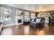 Inviting living room features hardwood floors, fireplace, and an open floor plan at 2415 E 110Th Dr, Northglenn, CO 80233