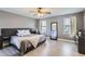 Spacious bedroom features ample natural light and hardwood floors at 2415 E 110Th Dr, Northglenn, CO 80233