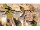 Aerial view of a well-maintained home with a spacious backyard, covered patio, and mature trees at 6110 E 6Th Avenue Pkwy, Denver, CO 80220