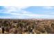 Panoramic aerial view showcasing a cityscape surrounded by lush greenery, mountains, and a clear sky at 6110 E 6Th Avenue Pkwy, Denver, CO 80220