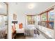 Bright bedroom with ample natural light from large windows, featuring a comfortable bed and stylish decor at 6110 E 6Th Avenue Pkwy, Denver, CO 80220