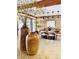 Dining area featuring a round table, brick wall, pendant lighting, and modern decor at 6110 E 6Th Avenue Pkwy, Denver, CO 80220