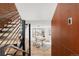 Inviting entryway features a modern staircase, hardwood floors, and an entryway to an adjacent office space at 6110 E 6Th Avenue Pkwy, Denver, CO 80220