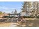 Inviting two-story home with manicured landscaping, stone accents, and a charming walkway leading to the entrance at 6110 E 6Th Avenue Pkwy, Denver, CO 80220