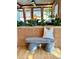 Stylish bench and pillow with plants and a view into dining area at 6110 E 6Th Avenue Pkwy, Denver, CO 80220