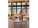 Bright living room with large windows, comfortable seating, and stylish decor for a cozy and inviting atmosphere at 6110 E 6Th Avenue Pkwy, Denver, CO 80220