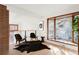 Modern living room with a large bay window, hardwood floors, and unique decor at 6110 E 6Th Avenue Pkwy, Denver, CO 80220