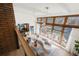 Open-concept living room with large windows, hardwood floors, and stylish furniture arrangement at 6110 E 6Th Avenue Pkwy, Denver, CO 80220