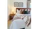 Cozy main bedroom features soft lighting, comfortable furnishings, and stylish decor at 6110 E 6Th Avenue Pkwy, Denver, CO 80220