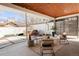 Relaxing covered patio with stylish seating, string lights, and a hot tub for ultimate outdoor enjoyment at 6110 E 6Th Avenue Pkwy, Denver, CO 80220