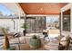 Relaxing outdoor patio with comfortable seating, string lights, and a view of the backyard at 6110 E 6Th Avenue Pkwy, Denver, CO 80220