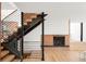 Staircase features modern steel and brick accents, with open risers for a light, airy feel at 6110 E 6Th Avenue Pkwy, Denver, CO 80220