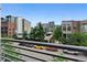 A wide angle view from the balcony showing street with parked cars and surrounding buildings at 2955 Inca St # 2D, Denver, CO 80202